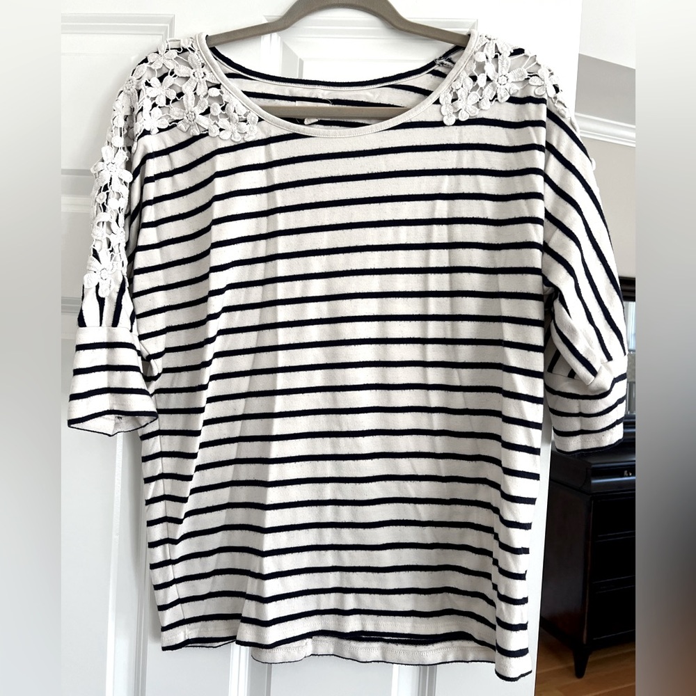 Navy and white striped short sleeve sweater with detailing on each sleeve